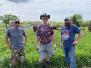 From left to right: John, Steve and Ryan after getting the cows to their first grass.